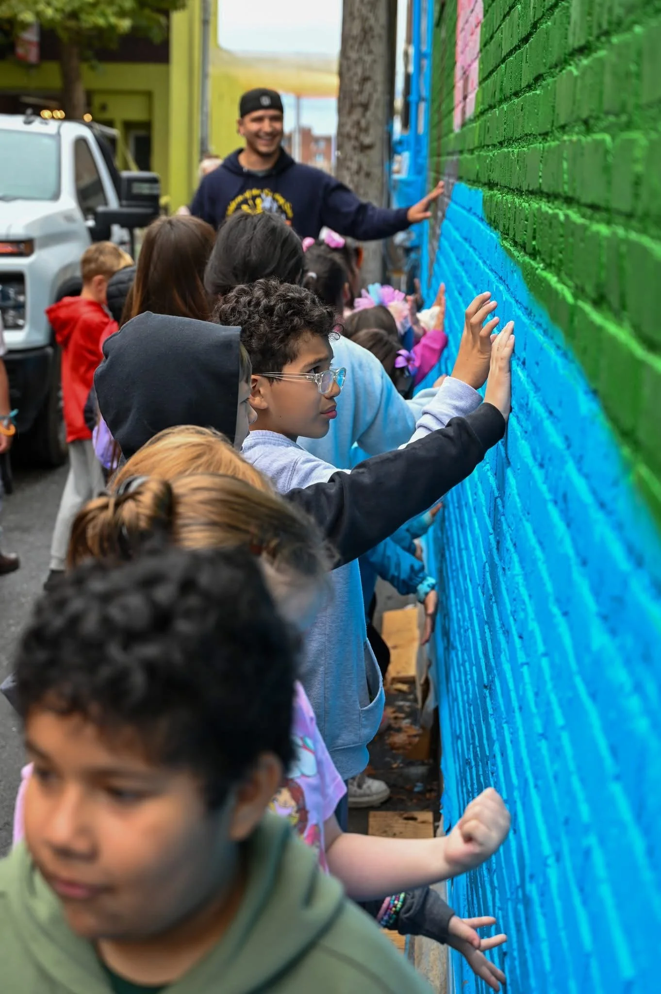Children participating in community mural activation
