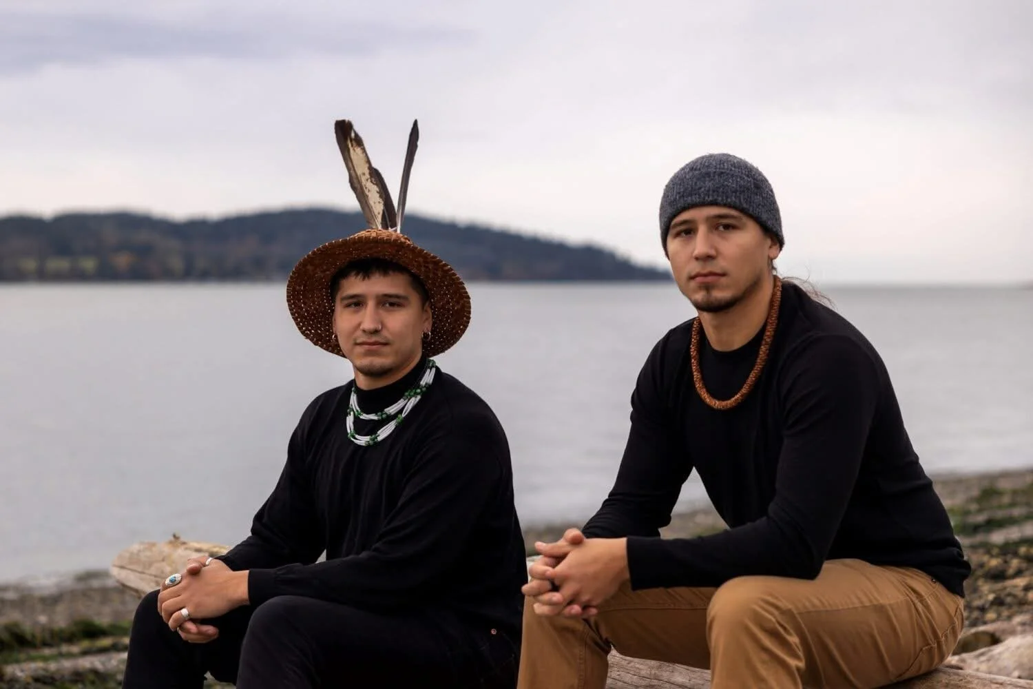 Free Borsey and Raven Borsey at the Bellingham waterfront, one wearing a traditional cedar hat