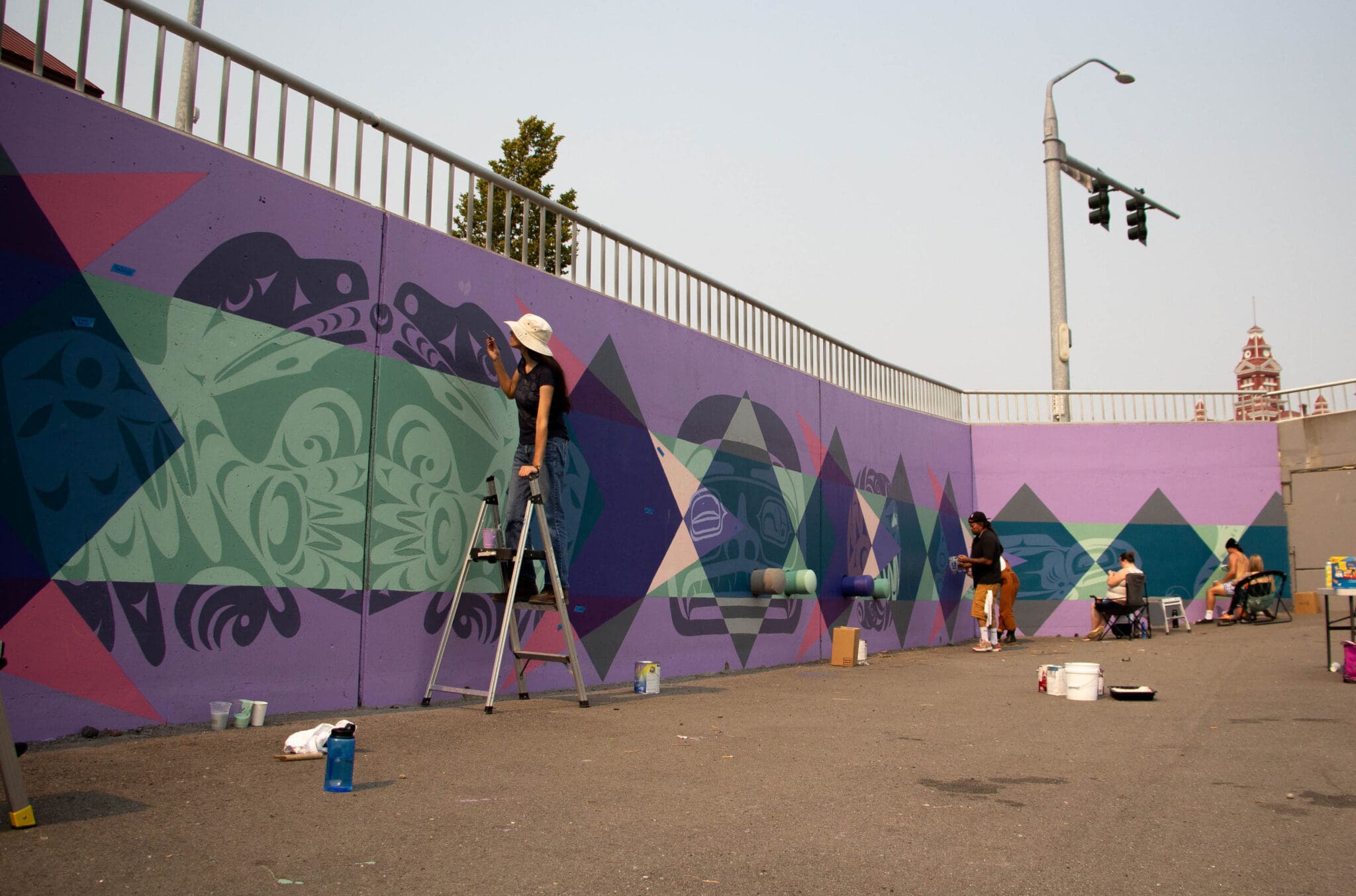 Wide angle view of the Indigiversal Collective Mural at the Bellingham waterfront, Noisy Waters Mural Festival